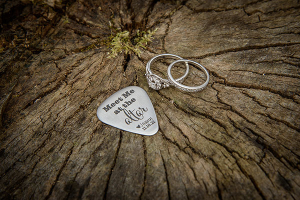 Rustic wedding rings with guitar pick